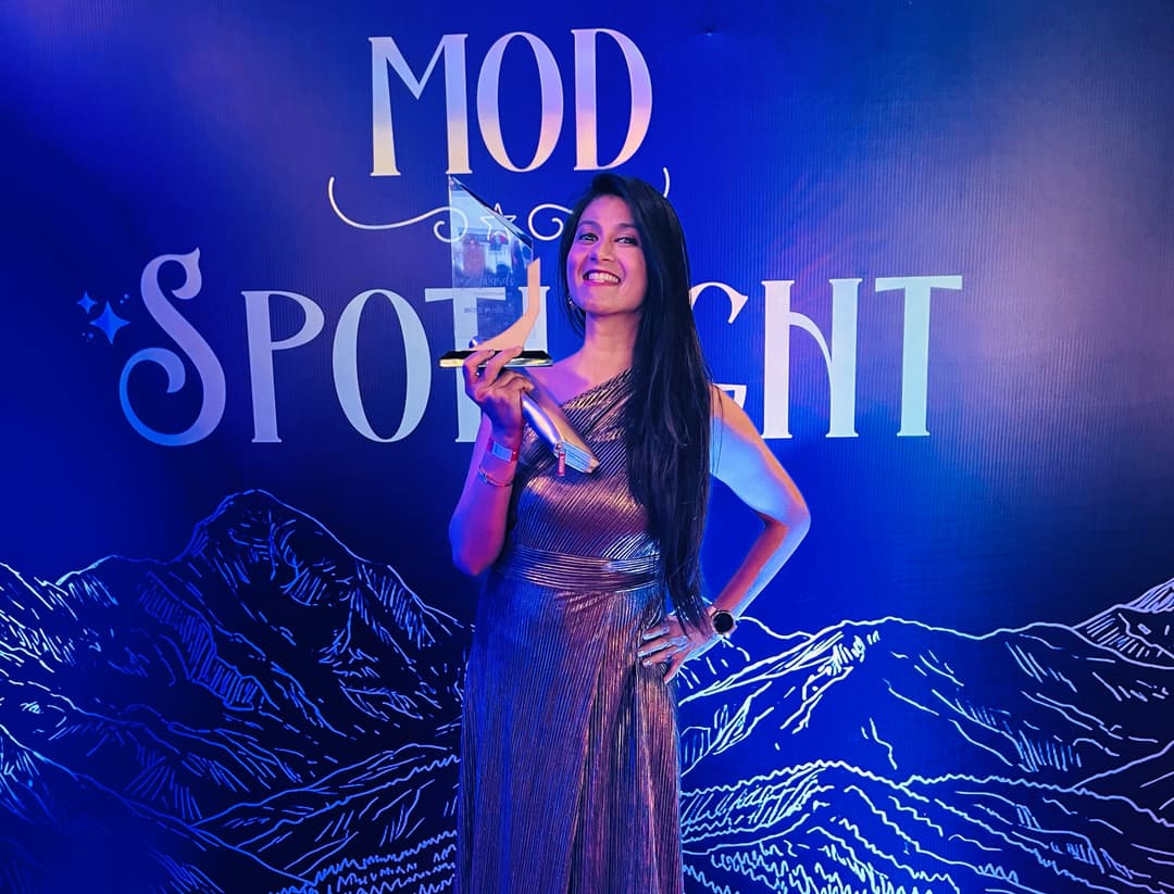 Neha Raj holding the Best Creator Award 2026