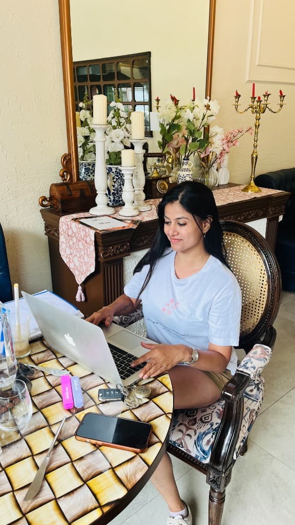 Neha Raj working on laptop