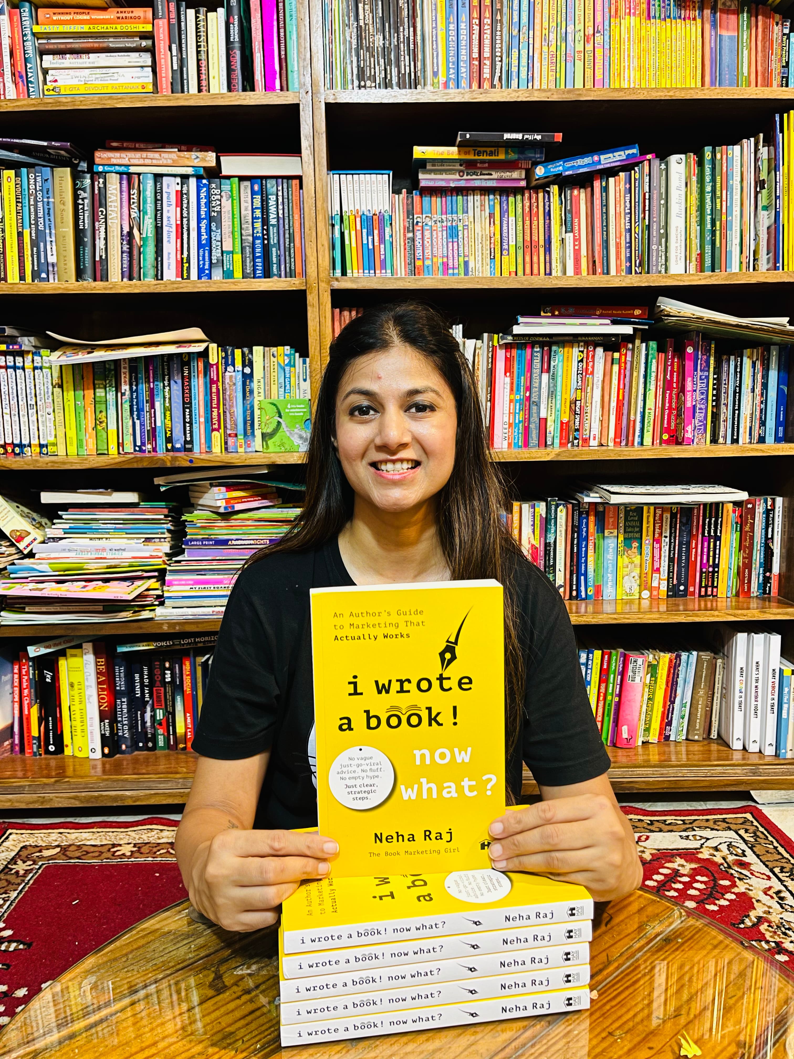 Neha Raj with Book Stacks